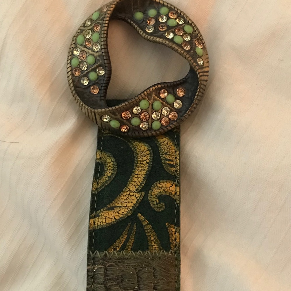 Rhinestone buckle belt in green tones.
